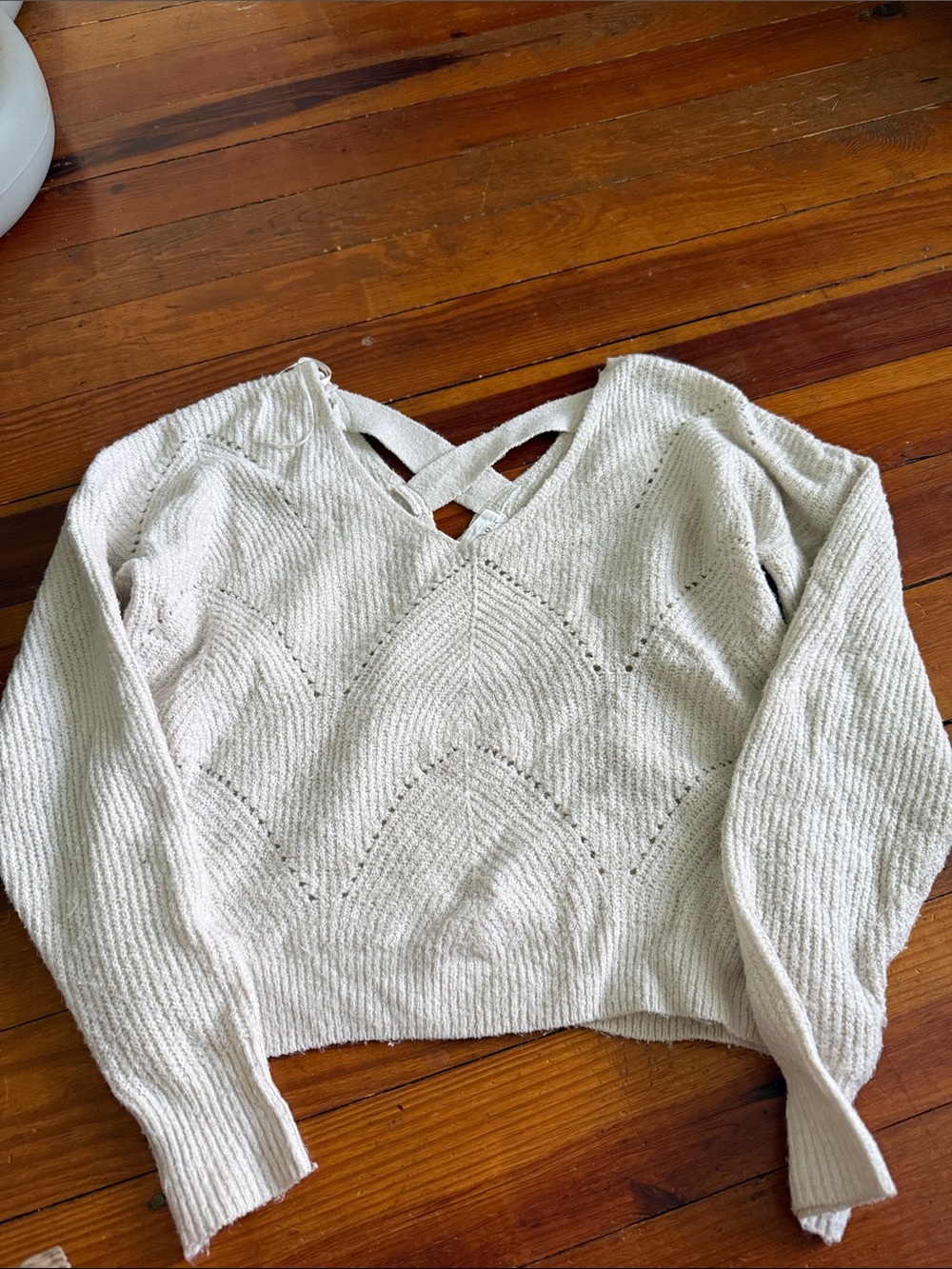 Cozy Cream V‑Neck Knit Sweater with Back Strap Detail